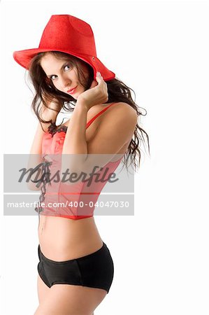sexy cowgirl with red corset and black short pulling down the hat