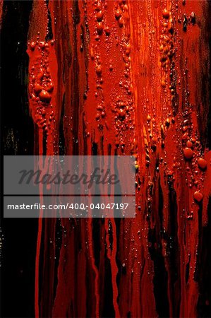 Image of blood and guts splattered against a black surface.  Background image for horror / halloween, etc.
