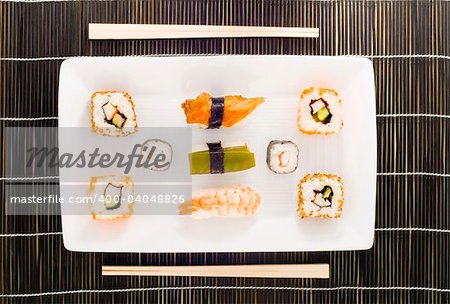 a plate with different kinds of sushi