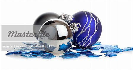 Christmas balls lying on blue stars, isolated