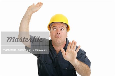 Construction worker trapped in invisible box.  Isolated on white.