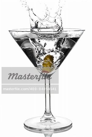 Olive splashing on martini isolated on white stock photo
