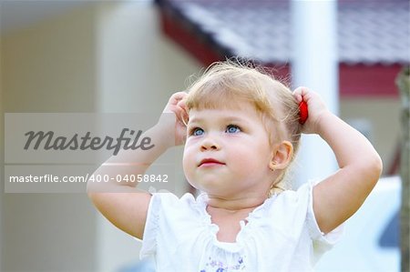 Outdoor  portrait of nice young blue eyed baby