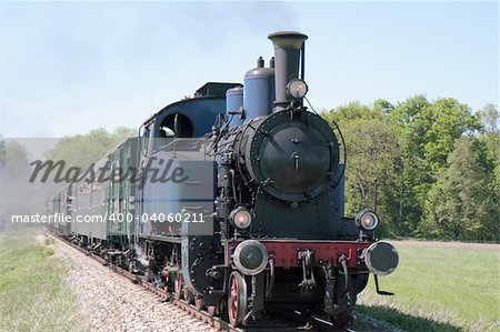 old steam engine powered train approaching