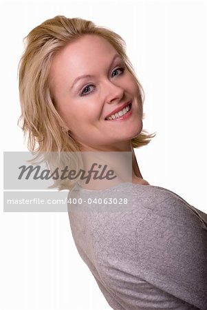 Portrait of an attractive woman with blond hair and blue eyes with nice smile facial expression wearing a casual grey top over white