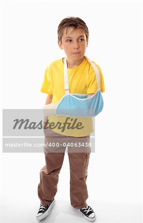 Boy with arm in an arm sling on a white background