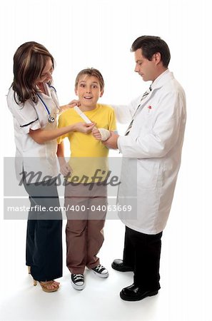 Doctor and a nurse or medical officer assist a young patient.