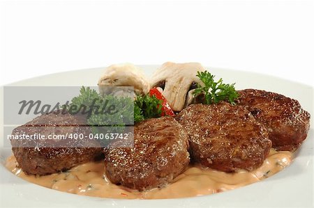 four cutlets with champignons