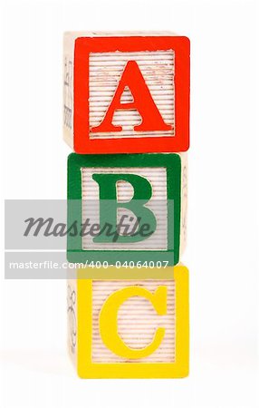 Alphabet blocks lined up to spell abc - isolated on white
