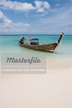 Longtail boat in bright blue water, Koh Poda, Krabi Province, Thailand