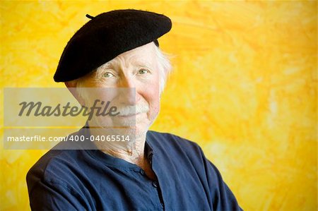 Portrait of an elderly painter wearing a beret