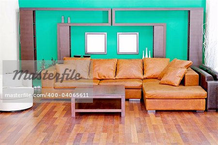 Green living room with brown leather sofa
