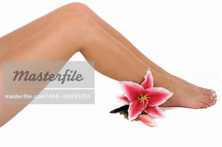 Beautiful legs with a pink lily flower