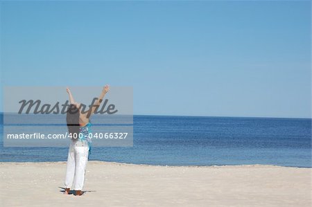woman doing exercise on the beach