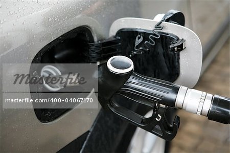 Refuelling of the car by gasoline under a rain