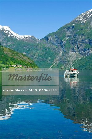 Boat in the ocean, Geiranger fjord, Norway view to the nature