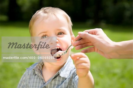 A Little Kid Eating Yogurt