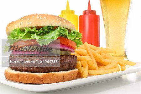 Hamburger served with french fries and a cold beer