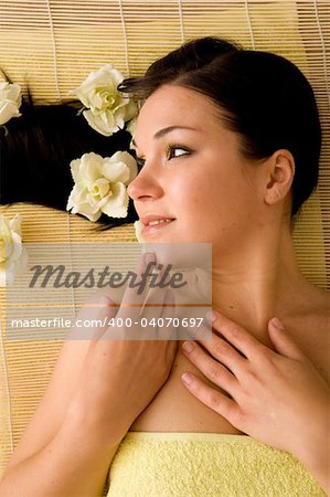 attractive brunette woman relaxing in massage