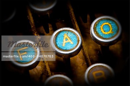 close up on old blue faq typewriter keys