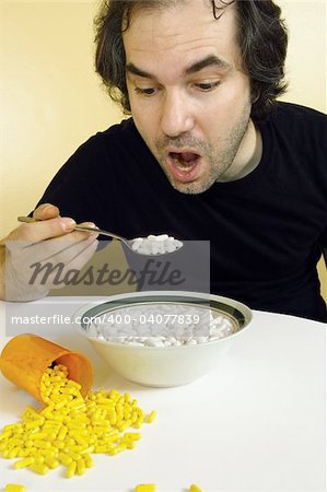 A man feeding himself medication with a spoon. Metaphor for addiction, dependency, etc.