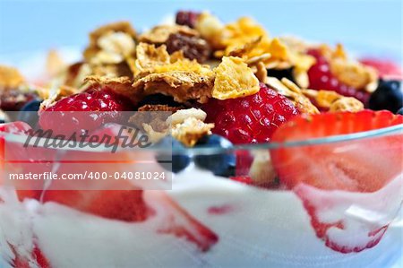 Serving of yogurt with fresh berries and granola