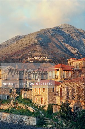 Picturesque traditional village from Mani peninsula, southern Greece, glowing in the  late afternoon light. Room for text on top