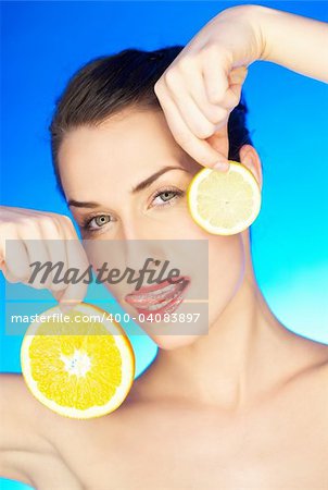 Portrait of beautiful woman with citrus slices