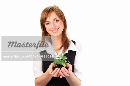 Woman holding a plant and smiling