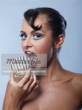 Beautiful blond woman with cookie in hand