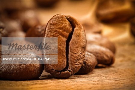 Closeup shot of a coffee bean on wood