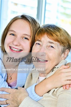 Granddaughter giving a hug to her grandmother