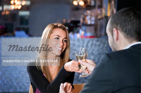 mid adult couple toasting in restaurant. Copy space