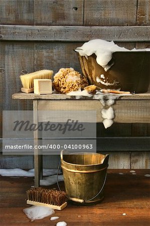 Old wash tub with soap and scrub brushes