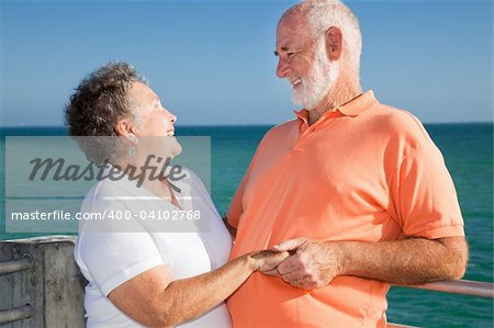 Happy senior couple in love enjoying a romantic tropical vacation.