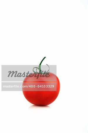 Image of a bright red single tomato on a white background
