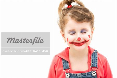 Little girl clown imagining happy thoughts