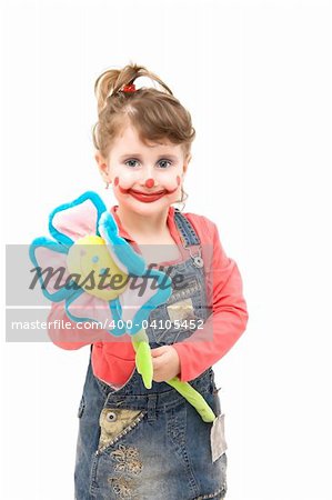 Little girl as a happy clown with a flower