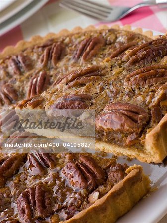 Pecan Pie With A Slice Being Cut