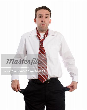 An unemployed man holding out his empty pockets, isolated against a white background