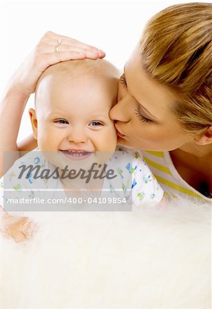 Young attractive mother kissing cute little baby