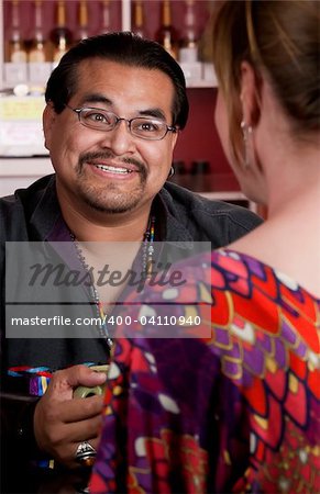 Handsome Native American man with female friend in a restaurant