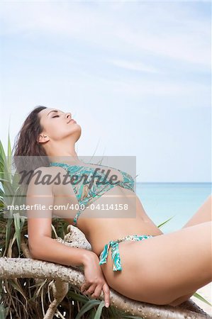 Portrait of beautiful girl having good time on tropical beach