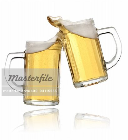 Pair of beer glasses making a toast. Beer splash
