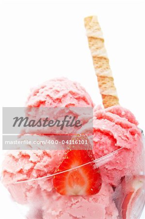 Delicious strawberry ice cream in glass bowl isolated on white background. Shallow depth of field