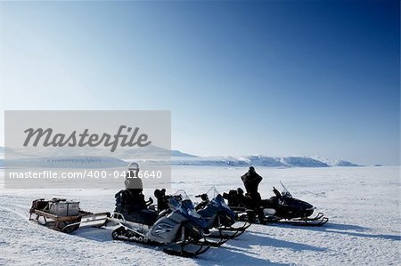 An expedition over a polar winter landscape with frozen ice