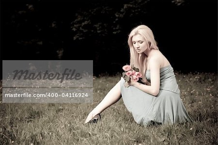 Beauty Woman Sitting OnThe Meadow