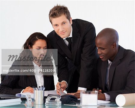 Young businessman working with his team in an office