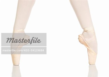Young caucasian ballerina girl on white background and reflective white floor showing various ballet steps and positions. Not Isolated