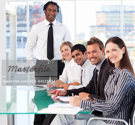 International business team working in office and smiling at the camera